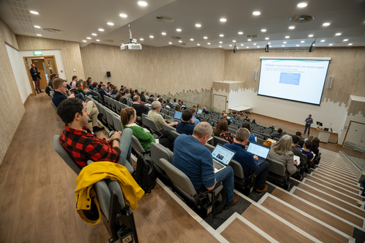 Group sitting in lecture theatre